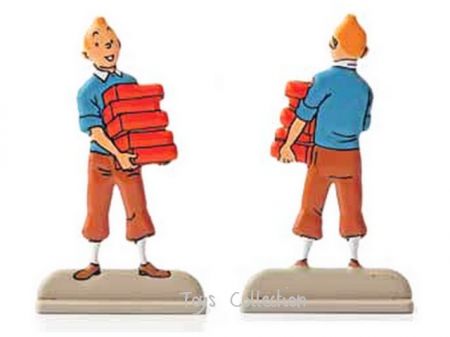 Tintin portant des briques